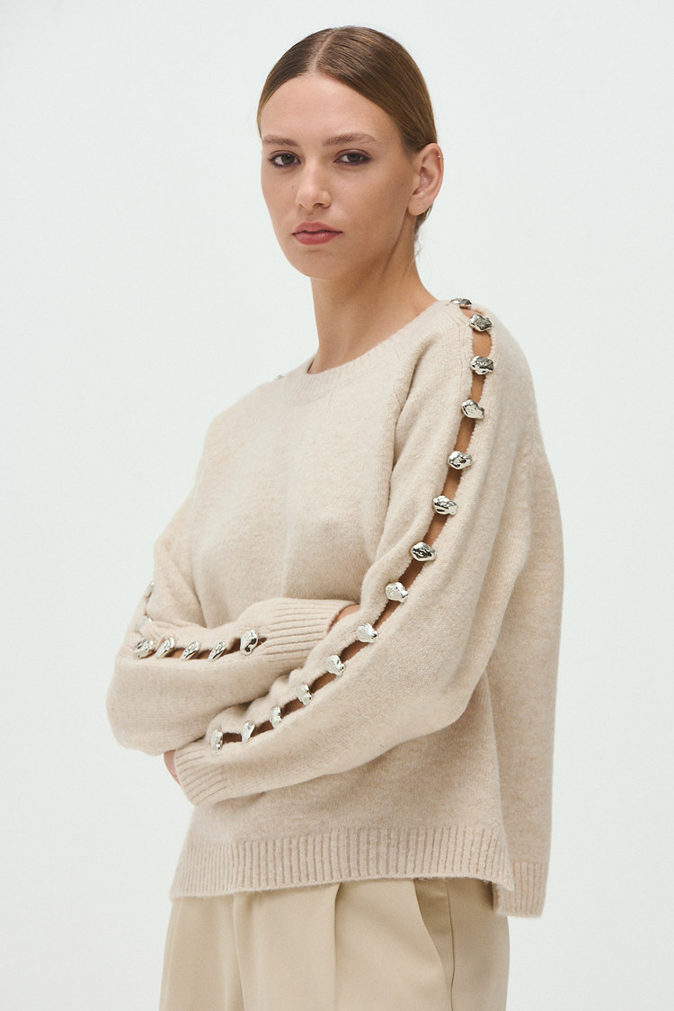sweater tejido aberturas en las mangas